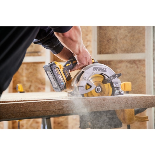 Circular saw cutting triple stack OSB with DEWALT POWERSTACK five amp hour battery 